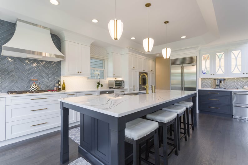 Craftsman built kitchen with grey island and gold accents 