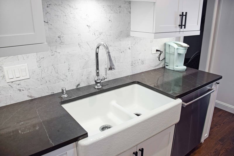 Gray Countertops with veining and farmhouse sink