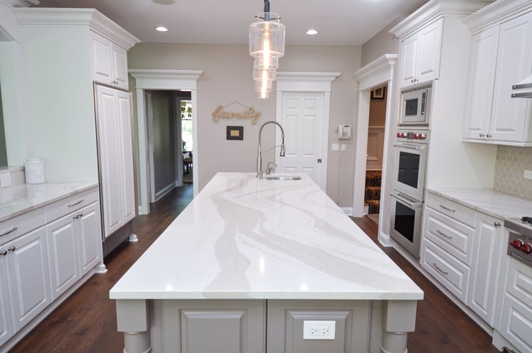 Kitchen with large island in the middle. 