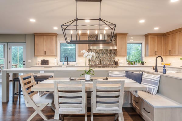 Tan and beige kitchen with extended L-shaped island and banquette 