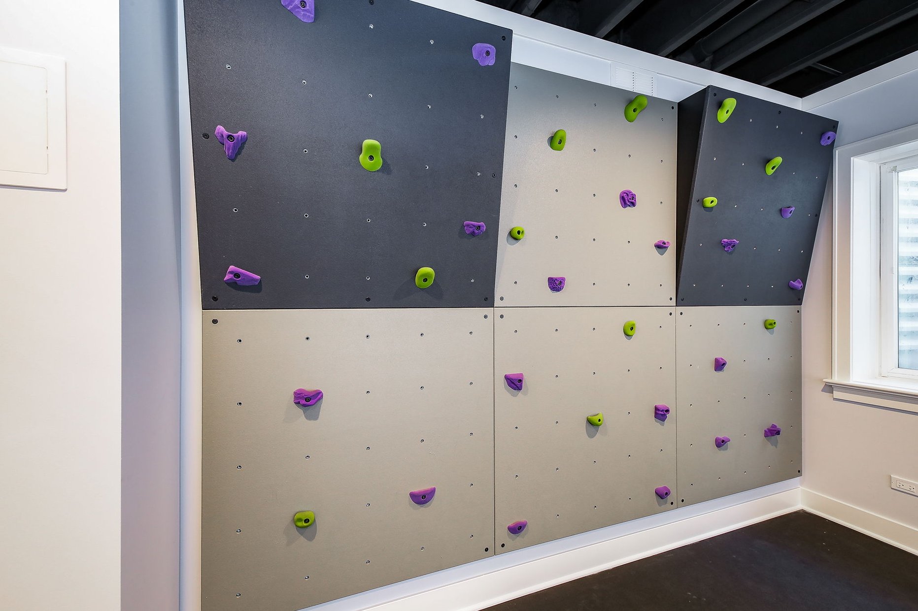 In home rock-climbing wall in a finished basement 
