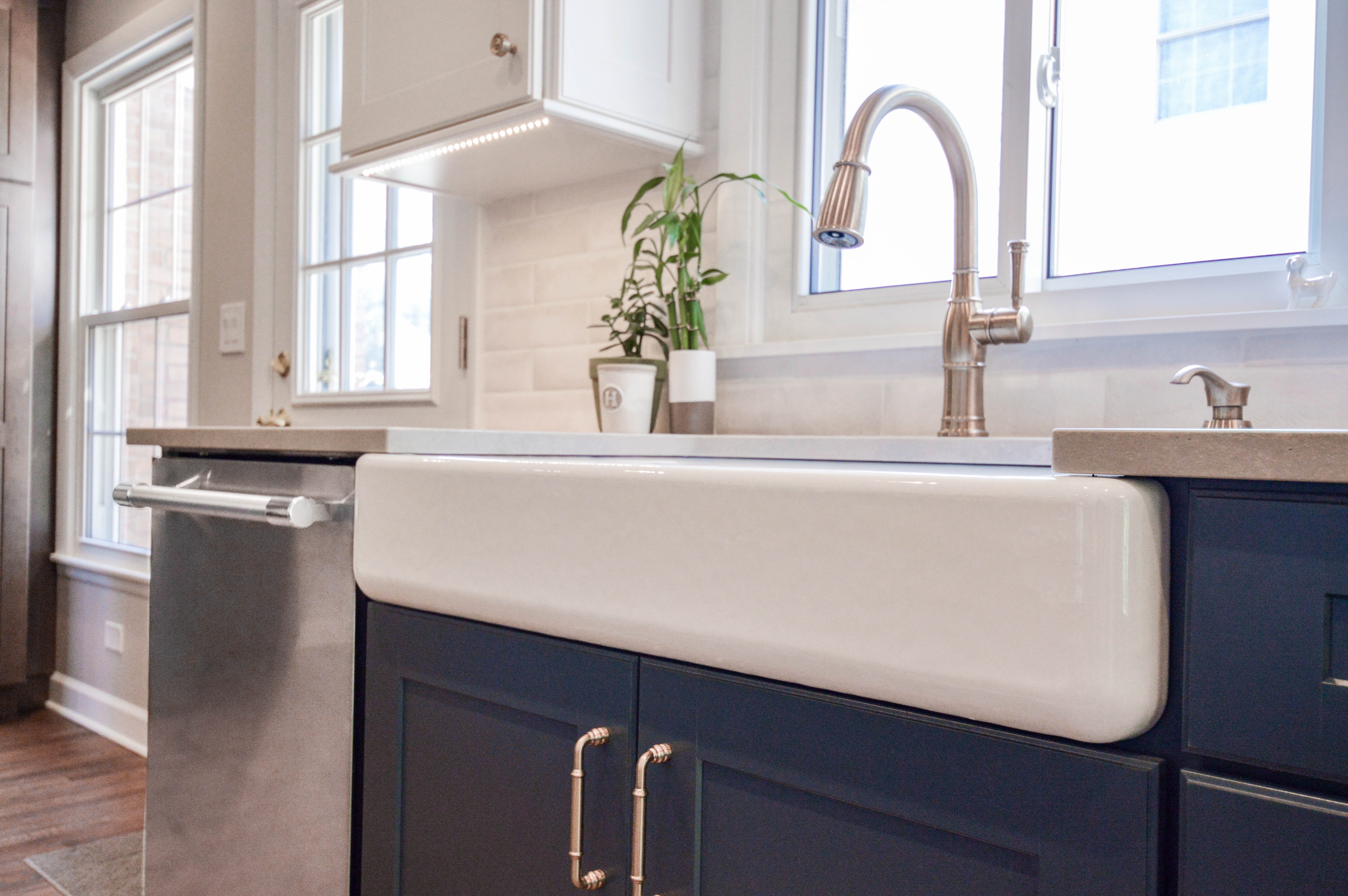 farmhouse sink with stainless steel faucet 