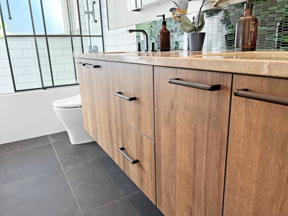 Bathroom with maple wood cabinets and matte black hardware