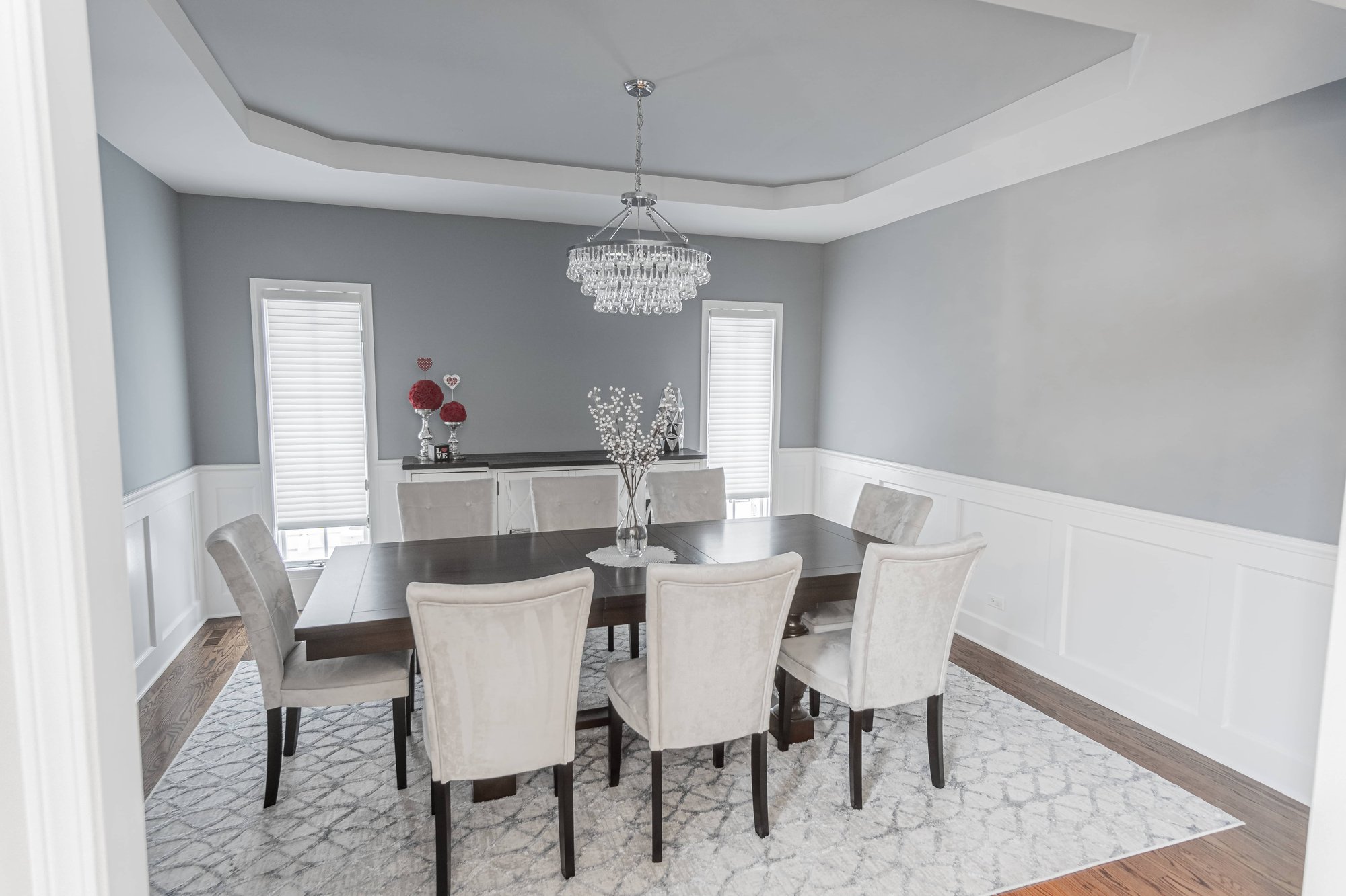 Grey dining room with white wainscotting in elmhurst