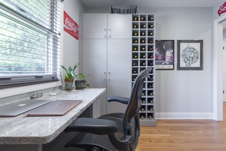 in-home office with grey quartz desk top and wine storage 