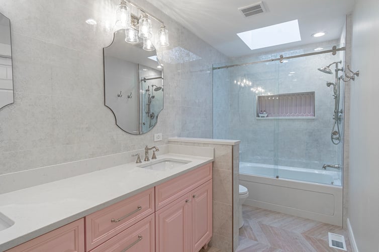 Dopamine Decor Bathroom with Pink Cabinets and Shower Niche
