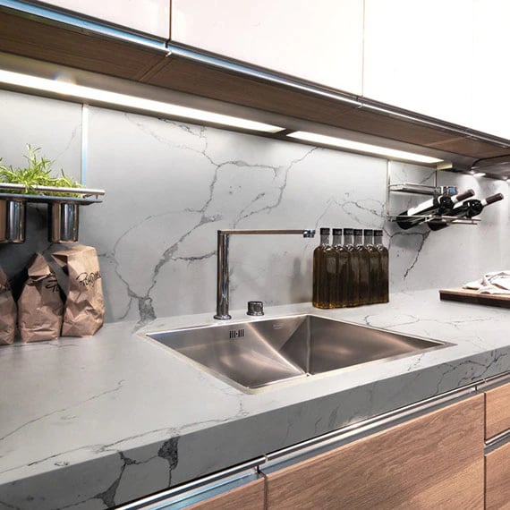 slab backsplash with grey veining. 