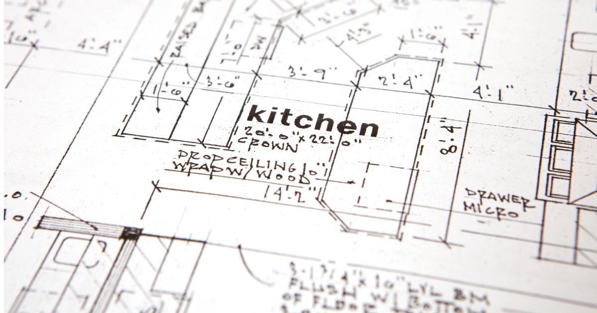 Collage of kitchens and laundry rooms. The middle image is a blue island kitchen with stained wood cabinets in the back, a box hood, and sculptural light fixtures.  then there is a first floor remodle with a stained wood island a grean wall cabinets and a living room in the back. There is a laundry room with blue cabinets.